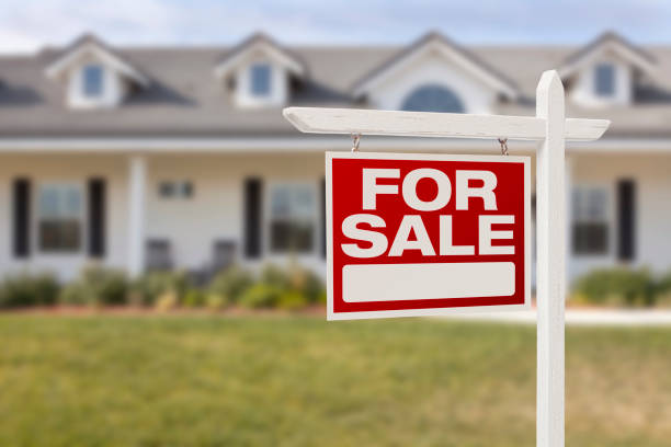 istock New home with a red for sale sign 177497166
