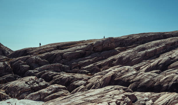 Couple hiking outdoors. Adventures in summer Norway, in the Bergen area.