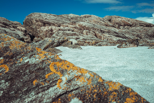 Granite rock and sandy beach coast of Norway