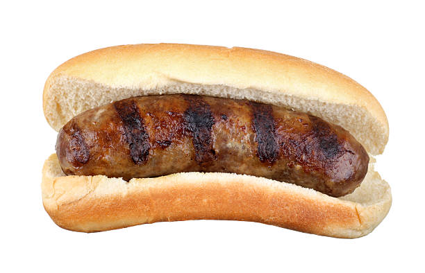 Grilled Bratwurst Isolated Grilled bratwurst on a bun isolated on white bratwurst stock pictures, royalty-free photos & images