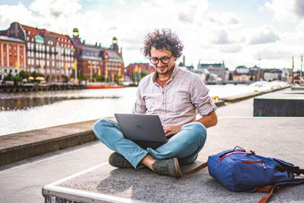 istock Businessman working on laptop by the river in Malmo, Sweden 1774980249