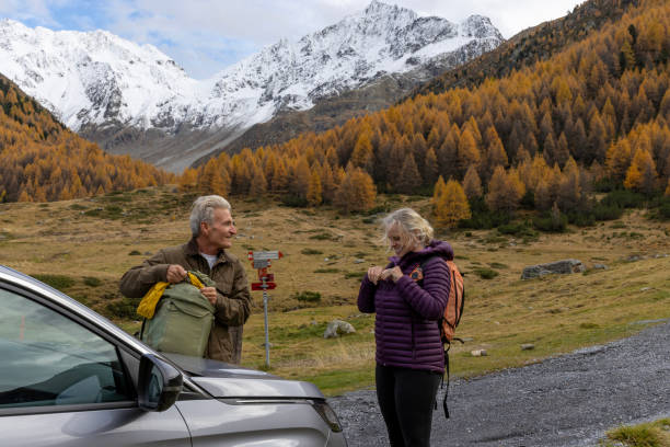 istock Mature hikers leave vehicle in mountain meadow 1774981035