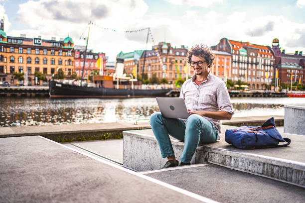 istock Businessman working on laptop by the river in Malmo, Sweden 1774981426