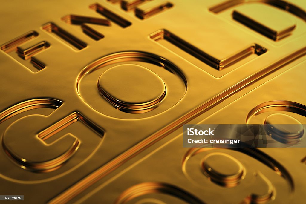 Gold bar close-up Close-up view of a gold bar with shallow depth of field. Banking Stock Photo