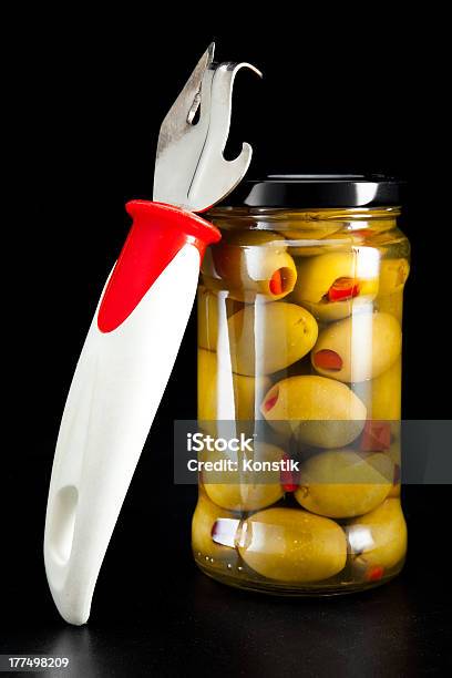 Glass Jar With Tinned Olives And A Can Opener Stock Photo - Download Image Now - Agriculture, Can, Colors