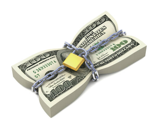 Dollar stack tied by chains stock photo