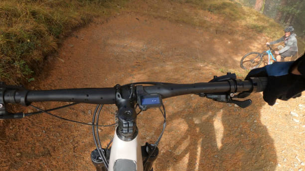 istock POV of mountain bikers descending mountaintop trail 1774983866