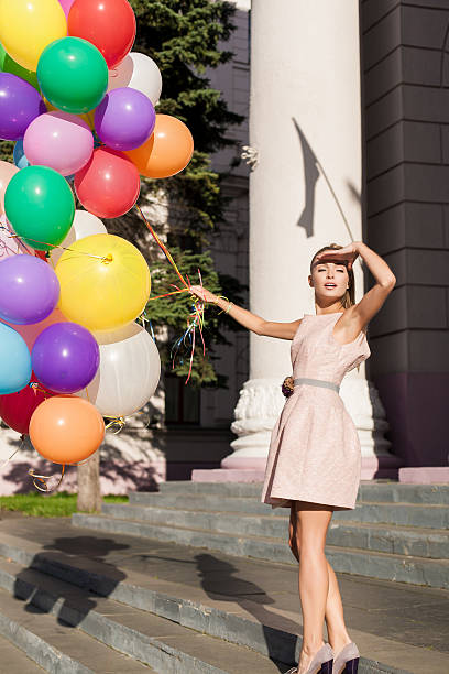 istock woman with balloons 177498441