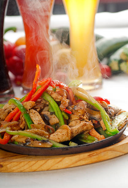 istock original fajita sizzling hot  on iron plate 177498775