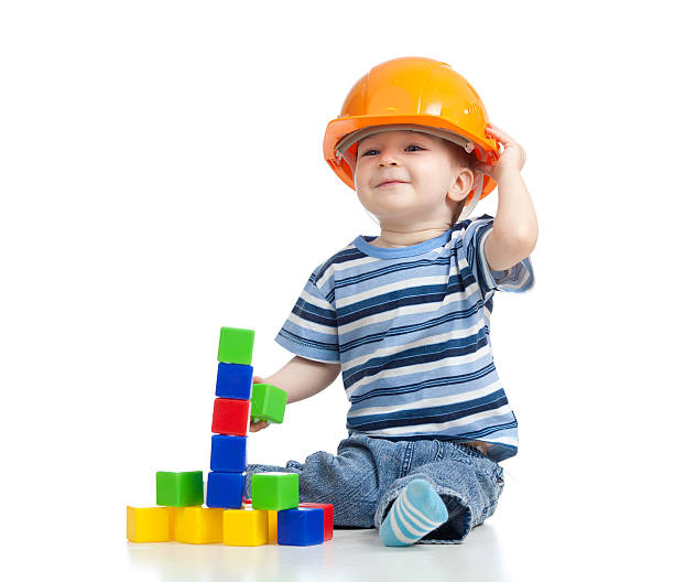 smiling kid playing with building blocks toy