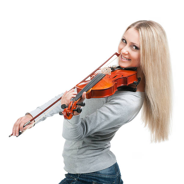 istock young smiling girl playing the violin 177499606