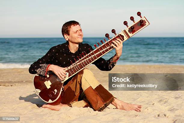 Man Playing On The Sitar Stock Photo - Download Image Now - Adult, Arts Culture and Entertainment, Blue