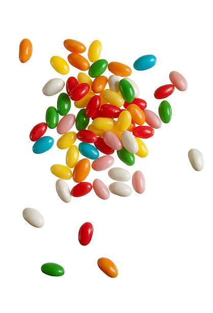 fallenden farbe jelly beans - falling beans stock-fotos und bilder