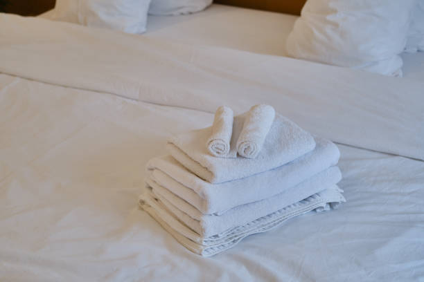 istock A stack of clean white towels on the bed. Hotel service. Place for text 1775017785