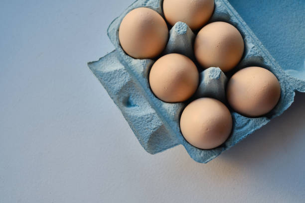 istock Cardboard boxes with chicken eggs. Boxes with uncooked eggs in table. Natural organic farm product. Preparing for Easter holiday. Fresh food delivery, carton package. Raw ingredient for cooking eat 1775018338