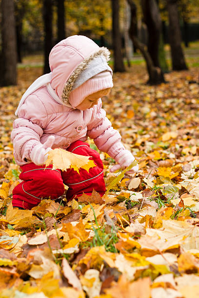 istock girl in autumn park 177502522
