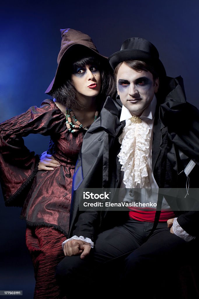 couple  wearing  as  vampire and witch. Halloween man and woman  wearing  as  vampire and witch. Halloween Adult Stock Photo