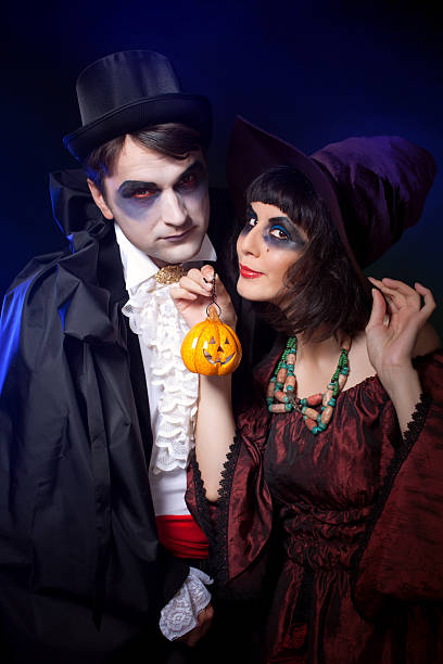 istock couple wearing  as  vampire and witch. 177503262