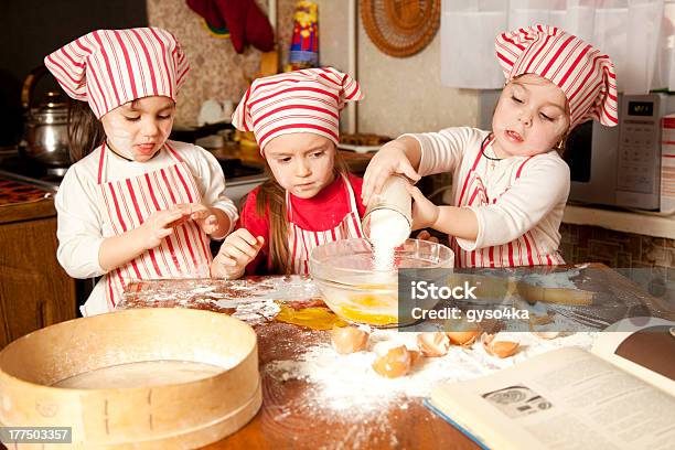 Three Little Chefs Enjoying In The Kitchen Stock Photo - Download Image Now - Baking, Child, 4-5 Years