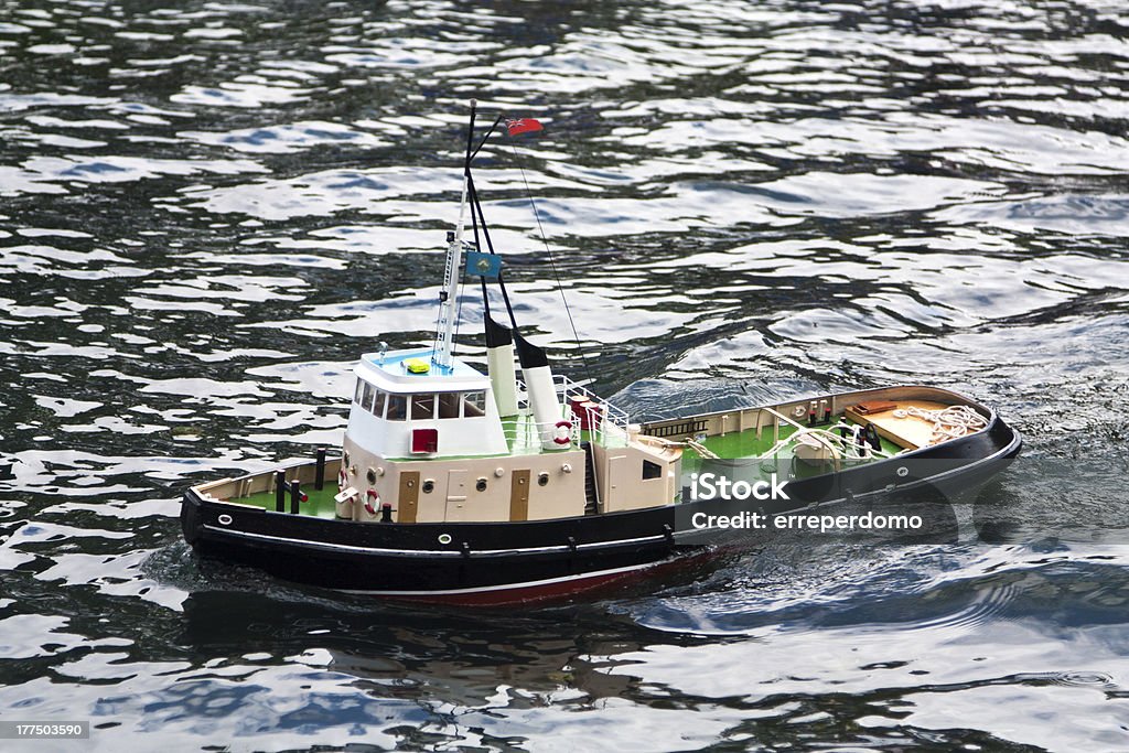 Model boat sailing Close shot of a model boat on the water. Color Image Stock Photo