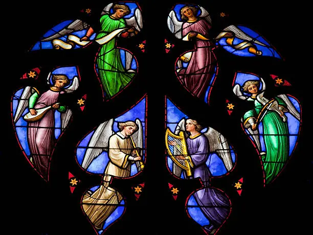 "Stained glass window depicting an Angels choir, in the cathedral of Brussels."