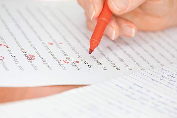 istock Hand with Red Pen Transcribing a Story 177504248
