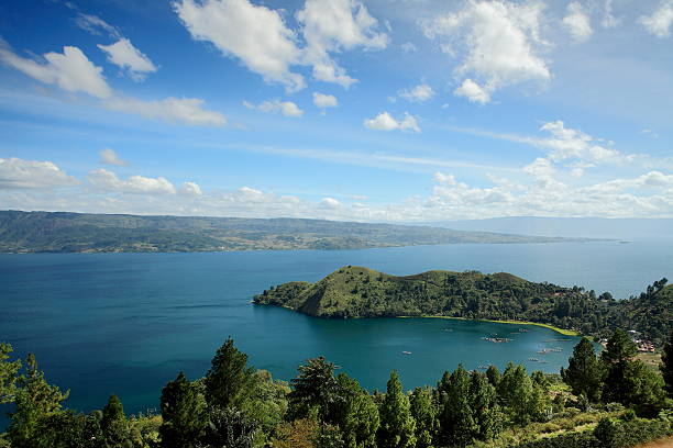 Camel Cape Tanjung Unta in Lake Toba with Samosir Island on the background danau toba lake stock pictures, royalty-free photos & images