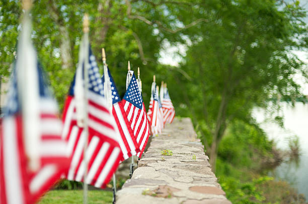 American flags on display outdoors stock photo