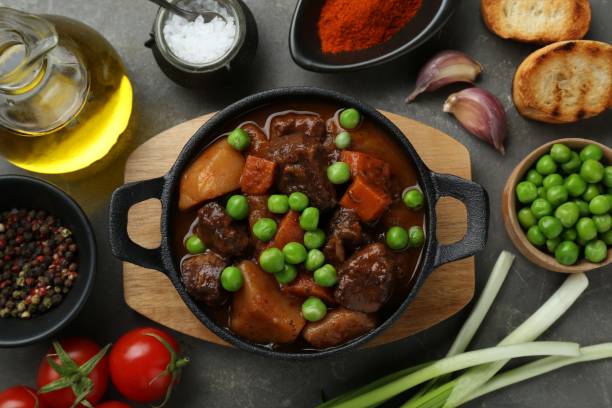istock Delicious beef stew and ingredients on grey table, flat lay 1775051655