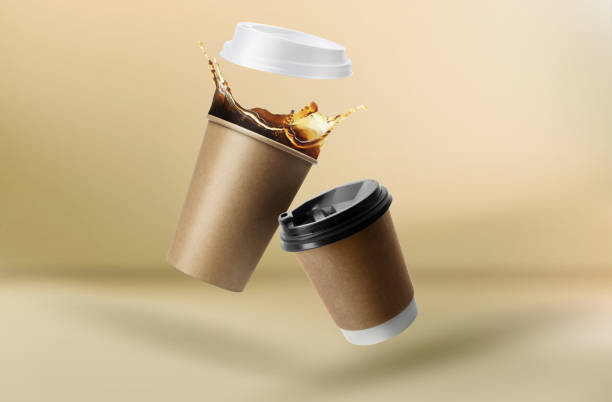 istock Takeaway paper cups falling on beige background 1775052208
