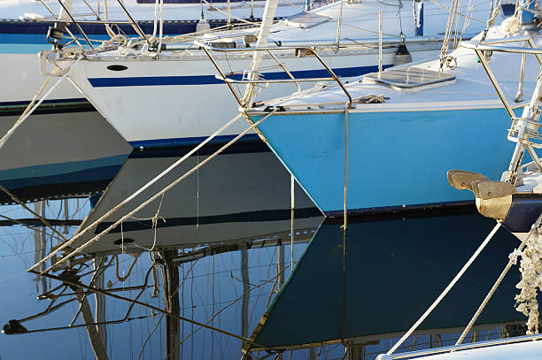 Prows of sailboats on the sea stock photo