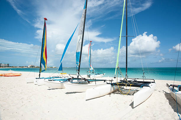 istock Catarmarans sitting idly on Caribean beach. 177505366