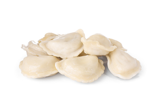Delicious dumplings (varenyky) with tasty filling on white background