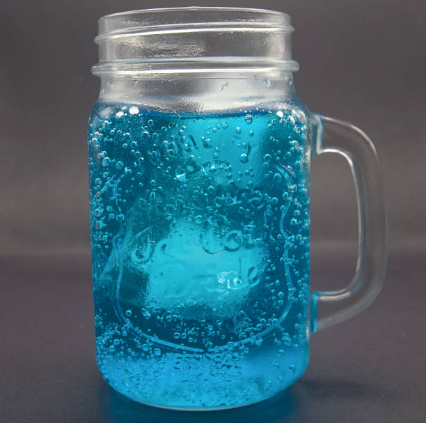 istock Blue drink, with ice served in a glass pitcher with black bottom. 1775060073