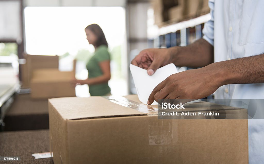 Labeling a box Filling orders in a warehouse Labeling Stock Photo