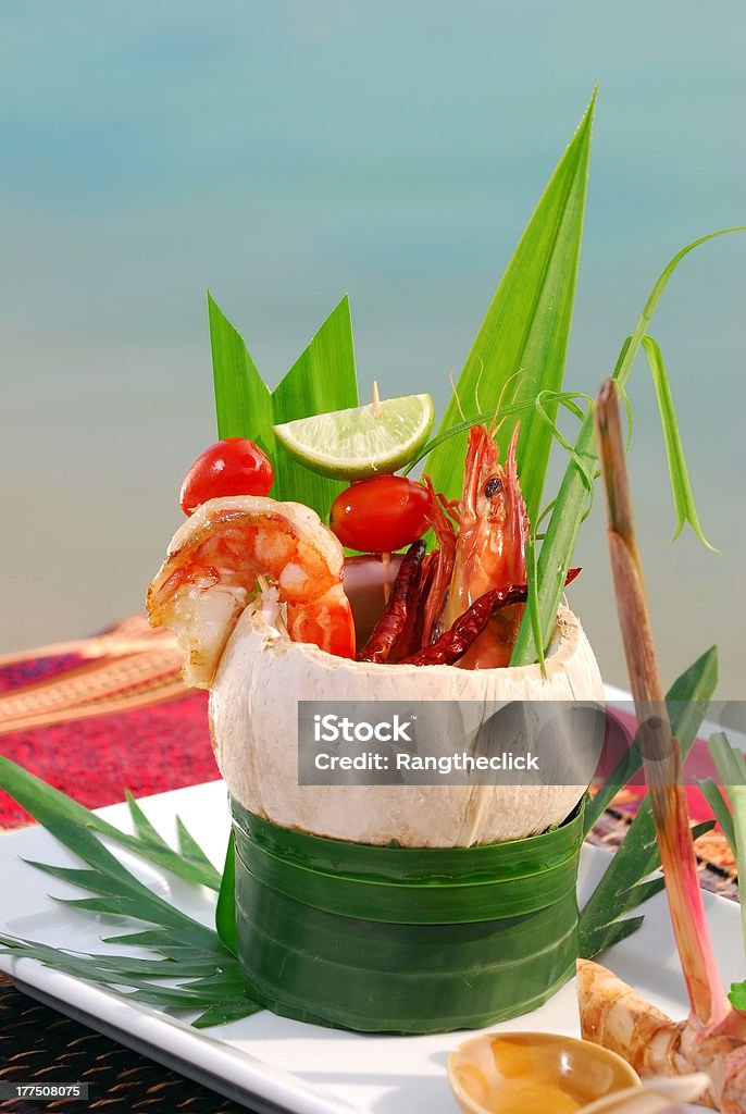 fantastic tom yum goong tom yum goong served with coconut shell Chili Pepper Stock Photo