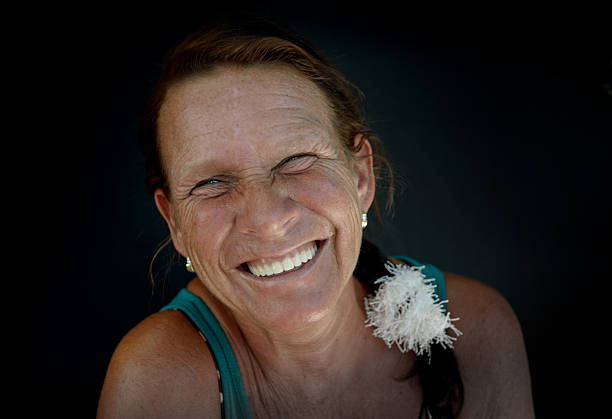 istock Tanned woman laughs 177508088