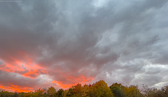 Fall color foliage hits Western Pennsylvania as a brilliant sunset descends the landscape.