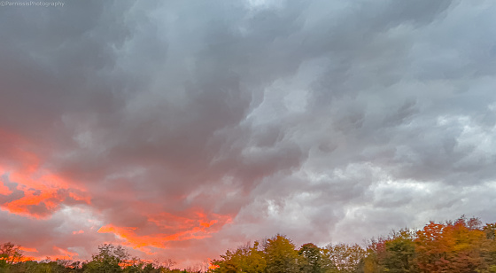 Fall color foliage hits Western Pennsylvania as a brilliant sunset descends the landscape.