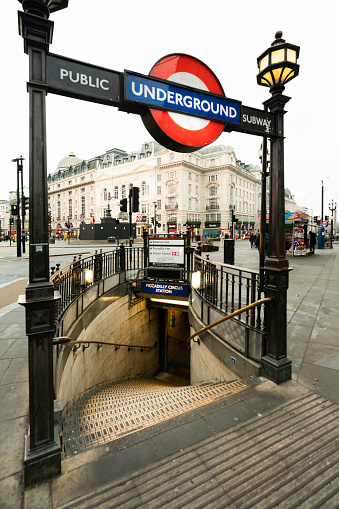 London, England, United Kingdom  - December 18, 2022: Entrance to the public underground subway transportation system  downtown.