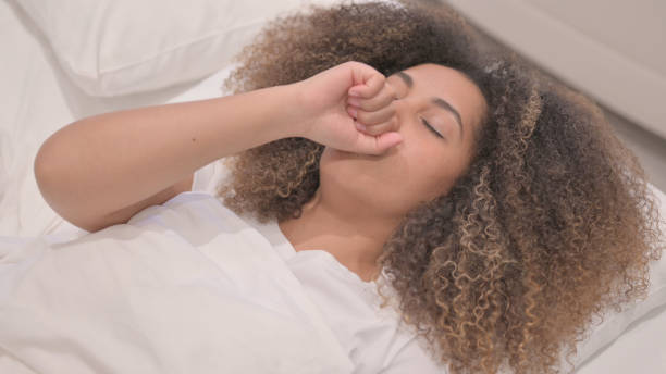 istock Sick African American Woman Coughing while Lying in Bed 1775084952