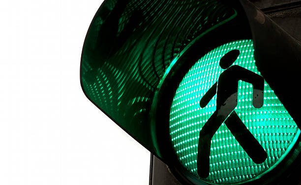 Walking signal turns green on a traffic light 