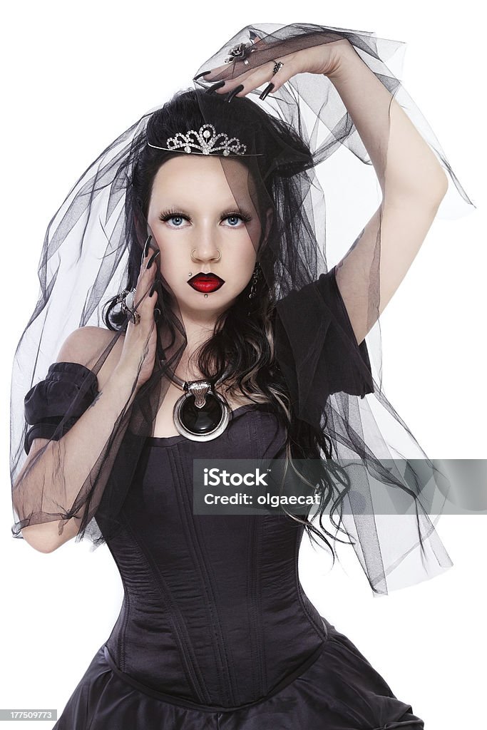 Gothic princess Young beautiful gothic woman in corset dress and black bridal veil over white background Bride Stock Photo