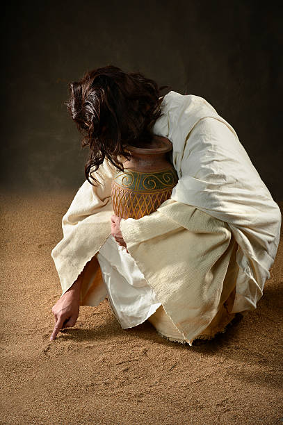 istock Jesus Writing in the Sand 177509948