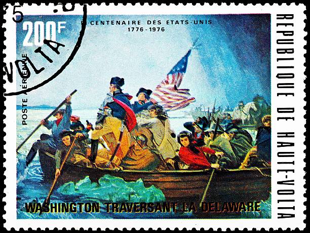 Washington Crossing the Delaware 1975 "UPPER VOLTA - CIRCA 1975:  A stamp printed in Upper Volta commemorates General George Washington crossing the Delaware River, Christmas Day to attack the British, circa 1975. - See lightbox for more" george washington photos stock pictures, royalty-free photos & images