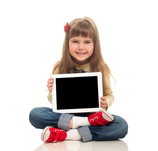 istock cute little girl sitting on the floor with tablet computer 177510937