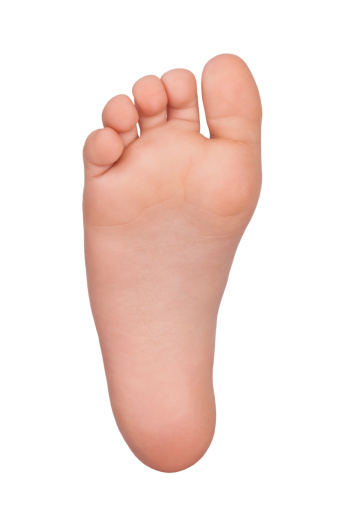 Bare foot child on a white background
