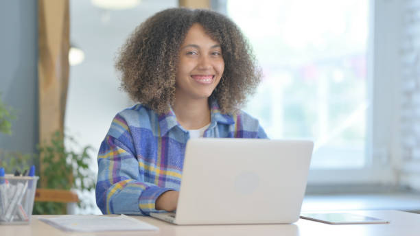 istock Thumbs Up by Young African Woman on Laptop Shaking Head in Approval 1775116607