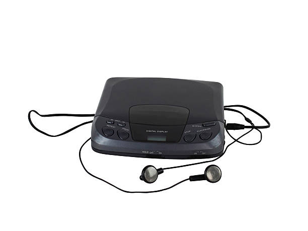 Old portable CD audio player Old portable CD audio player with headphones cd player stock pictures, royalty-free photos & images