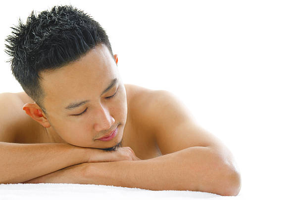 ビューティースパ - massaging men beauty spa beauty treatment ストックフォトと画像